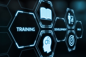 Futuristic design showing the words "training, development, skills" with a hand moved as if to tap one of the options.
